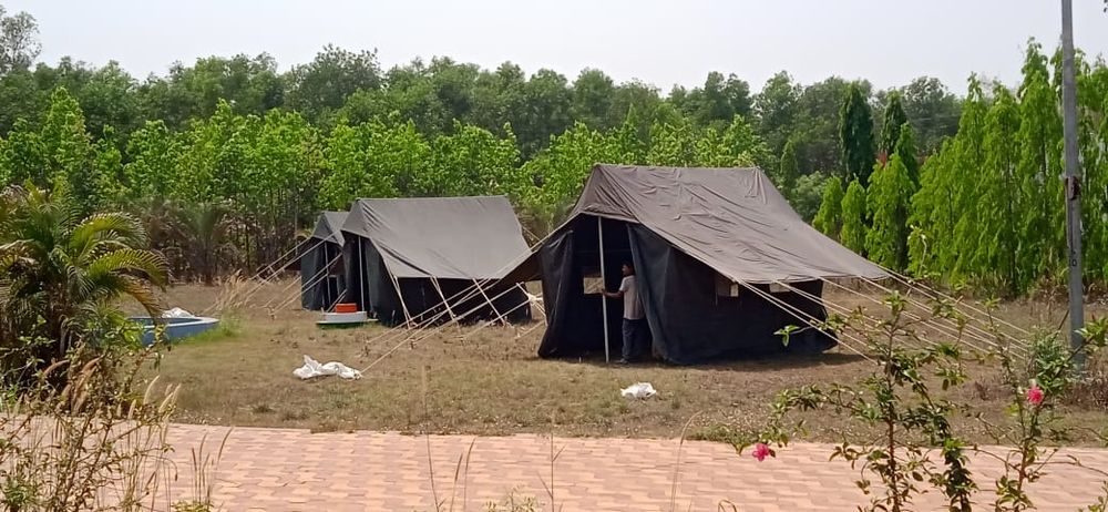 Double fly tents pitched at a camp